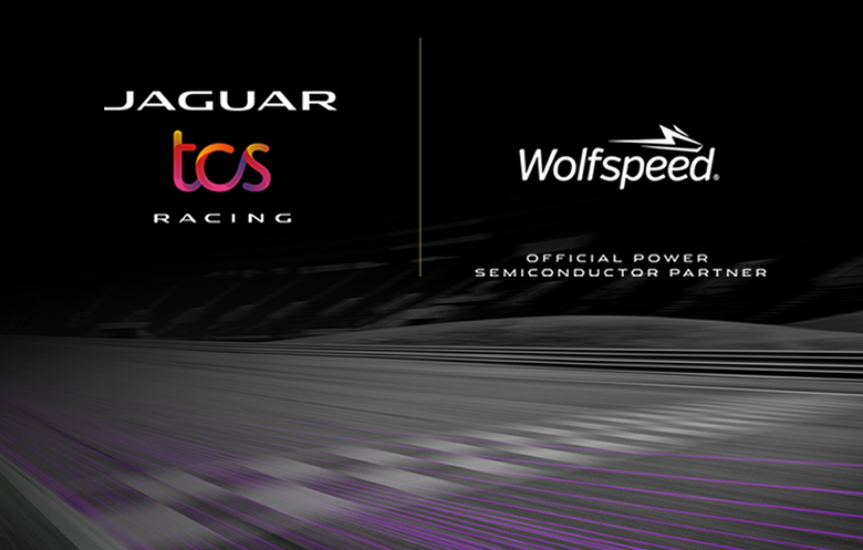Jaguar TCS Racing logo on the left and Wolfspeed logo on the right on a wide shot of a racecar track with motion blur and purple digital streaks tracing the track.